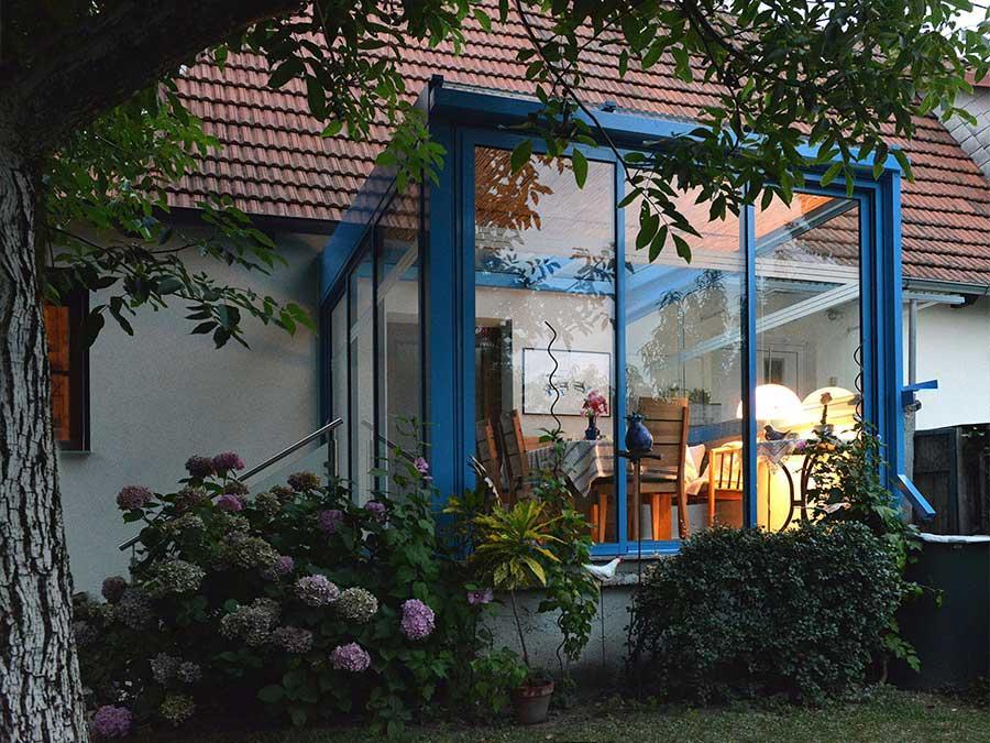 BAUMANN/GLAS Wohnlicher Wintergarten / PERG